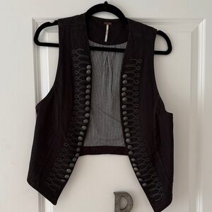 Free People Black military style vest with grommet accents.